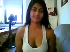 A stunning playgirl with ebony complexion shows off her enormous titties over a webcam.